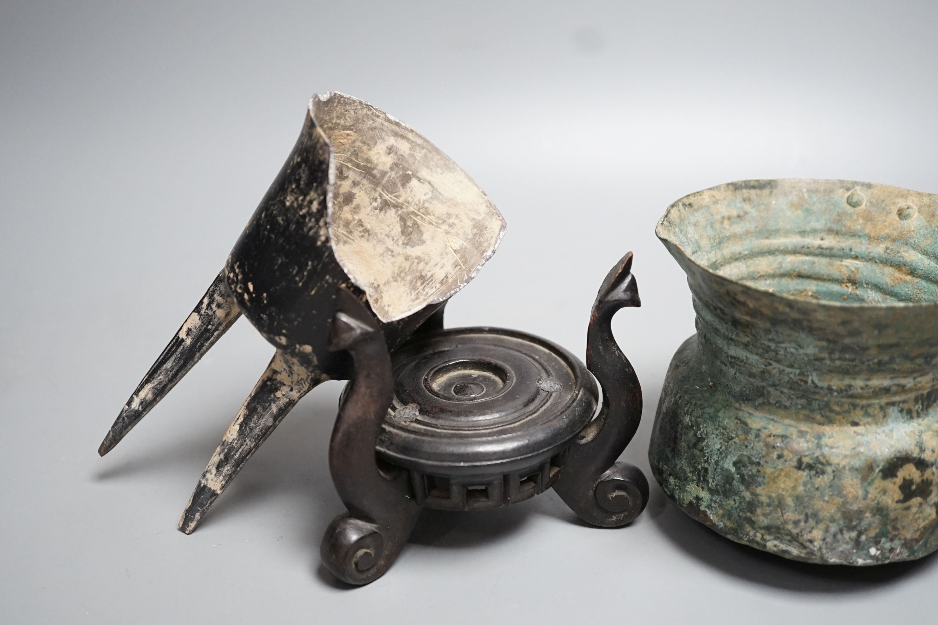 A Han dynasty pottery tripod vessel and a Roman jug